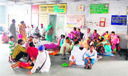 In the absence of a proper seating arrangement, attendants of patients sit on the floor at Civil Hospital in Amritsar.