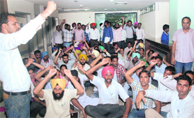 Members of various teachers and the unemployed teachers’ unions stage a protest at Punjab School Education Board office in Mohali on Monday.
