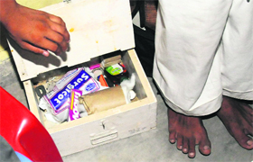 A first-aid box without bandages and ice-packs