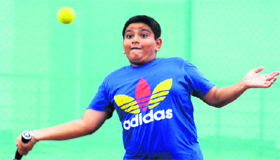 A player in action during AITA U-14 Tennis Tournament at The British School, Sector 70, in Mohali on Monday.
