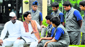 Dabbawalas interact with students at Chitkara International School, Sector 25, Chandigarh, on Monday.