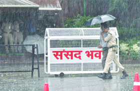 Security persons on the first day of the monsoon session at Parliament in New Delhi on Monday. 