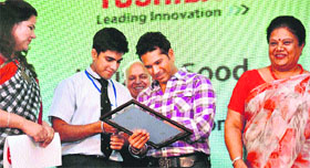 Cricketer Sachin Tendulkar gives autographs at the award function of Toshiba Bat for the Planet event in Gurgaon. 