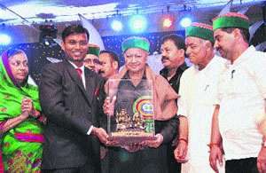 Chief Minister Virbhadra Singh being presented a memento by Deputy Commissioner Kadam Sandeep Vasant in Chamba on Monday.