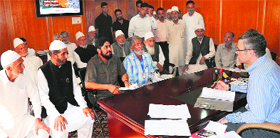 Chief Minister Omar Abdullah listens to grievances of people at his private office in Srinagar on Monday.