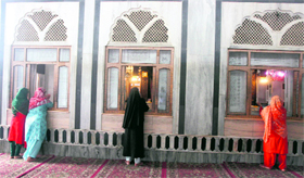 Women pray at Ziyarat Sultan ul Arifeen (Mukhdoom Sahib) on the 26th day of Ramadan in Srinagar on Monday.