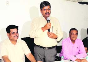 Sarup Chand Singla, Chief Parliamentary Secretary (excise and taxation), addresses a meeting of industrialists in Ludhiana on Monday