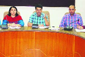 Deputy Commissioner Rahul Tiwari addresses a meeting at Bachat Bhawan in Ludhiana on Monday