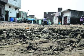 A muddy street of the colony