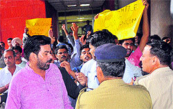 Mayor Subhash Chawla leaves the MC office, as protesting village residents try to gherao him in Sector 17, Chandigarh on Tuesday