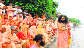 Saints offer pind daan to the disaster victims at the Ganga ghat in Haridwar on Tuesday.