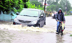 The waterlogged Turner Road in the Clementown area of Dehradun following heavy rains on Tuesday.