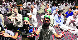Members of the Muslim community offer prayers in Srinagar on Tuesday