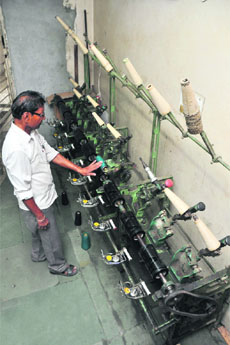 A labourer at work in a knitwear unit in Ludhiana.