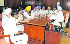 Congress MPs from Punjab and Haryana with Prime Minister Manmohan Singh at Parliament House, New Delhi, on Tuesday. 