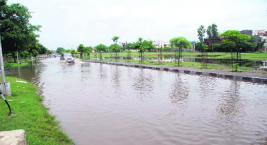A waterlogged road near the community centre in Model Town phase III where the BDA has planned a water harvesting project. Despite showers on Tuesday, the area remained flooded till Wednesday evening. 