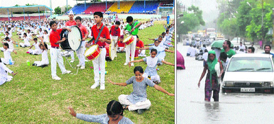 Patriotic fervour: Schoolchildren rehearse for the Independence Day celebrations in Bathinda; and (right) KNEE-DEEP: Commuters wade through a waterlogged road in Bathinda. 