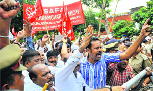 Sanitation workers stage a protest at Sector 17 in Chandigarh on Wednesday.