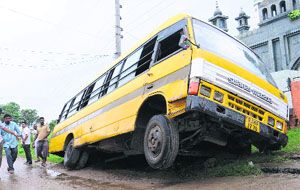 The school bus that got stuck in a trench at Kansal village on Wednesday. 