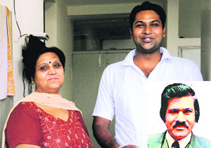 The wife and son of ML Arora (inset), who underwent a heart transplant, at the PGI in Chandigarh on Wednesday.