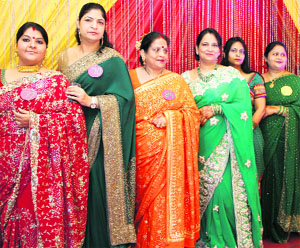 Members of the Dehradun Ladies Club participate in a Teej function in Dehradun on Wednesday. 