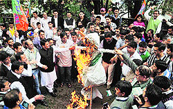 BJYM president Anurag Thakur and activists raise slogans and burn an effigy of Pakistan in Shimla on Wednesday