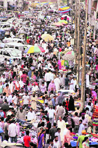 People busy shopping ahead of Eid-ul-Fitr at Lal Chowk in Srinagar on Wednesday.