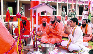 Head priest Mahant Deependra Giri performs a pooja at Sharika-Bhawani Temple, Hari Parvat, in Srinagar on Wednesday.