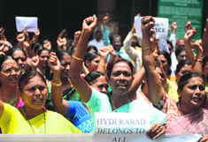 Government employees and other supporters of United Andhra Pradesh protest against the formation of Telangana in Hyderabad on Wednesday.