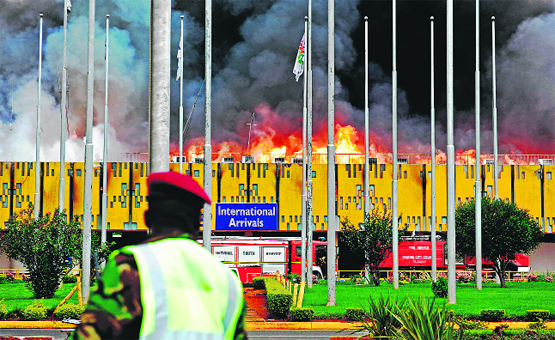 Flames and black smoke billow from the Jomo Kenyatta International Airport at Nairobi in Kenya on Wednesday.  AFP
