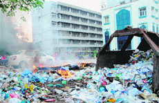 Biomedical waste being burnt on the premises of GND Hospital in Amritsar on Thursday.