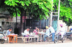 Touts working on road outside the Civil Surgeons office in Amritsar.