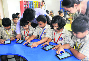 Students work on tablets at Bhavan Vidyalaya, Sector 33, Chandigarh, on Thursday. 