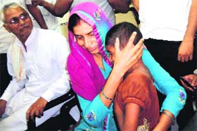 Parul in her mothers lap in Rewari on Wednesday night