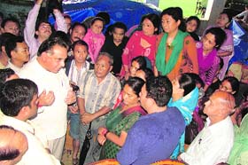 Transport and Food and Civil Supplies Minister GS Bali hears grievances of landslide-affected people at Dharamsala on Thursday