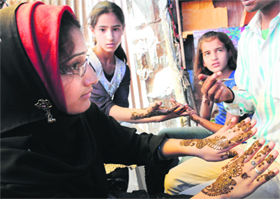 A group of girls with henna-adorned hands in Srinagar on Thursday.