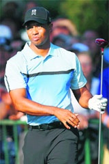 Tiger Woods looks at his shot during the first round of the PGA Championship on Thursday. 