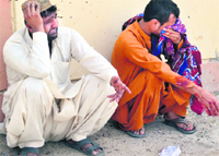 Mourners react after the killing of Pakistani police officers in Quetta on Thursday.  AFP