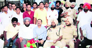 Police officials hold a meeting with the residents in Amritsar. 