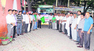 The truck carrying relief material for Uttarakhand flood victims being flagged off in Bathinda on Friday.