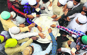 Phirni being distributed at Sector 56, Chandigarh, on Friday.