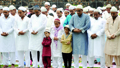 Muslims offer prayers at Feroz Shah Kotla mosque on the occasion of Eid-ul-Fitr in New Delhi on Friday.