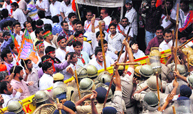Supporters of the BJYM, who were on their way to gherao the residence of the Chief Minister, being stopped by the police near the mini-secretariat before their arrest in Rohtak on Friday.