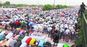 Devotees offer prayers at Tau Devi Lal Park in Gurgaon on Friday.