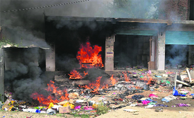 Shops set on fire during Fridays clashes.