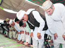 Chief Minister Omar Abdullah, his father and Union minister Dr Farooq Abdullah and others offer Eid-ul-Fitr prayers at Hazratbal on Friday. 