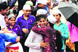 Muslims embrace each other after offering prayers on the occasion of Eid in Ludhiana on Friday. 