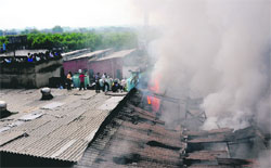 Flames engulf a godown of a clothing company near the Jalandhar Bypass in Ludhiana on Friday. 