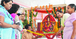 Women take part in the Teej celebrations at Shri Geeta Mandir in Ludhiana on Friday.