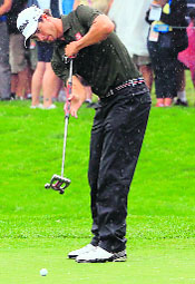 Adam Scott of Australia putts on the 11th hole during Round 2 of the 95th PGA Championship on Friday. 